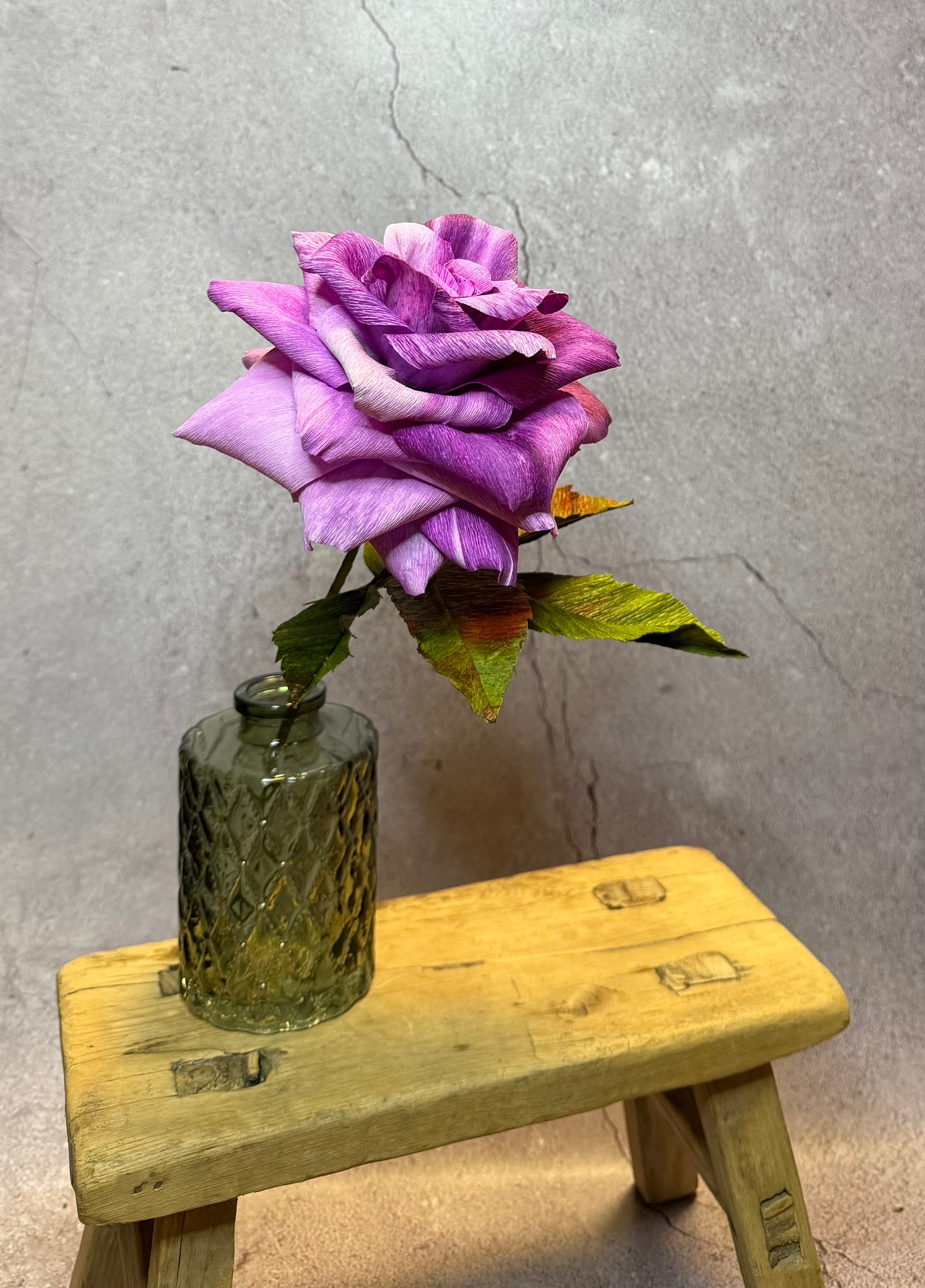 Large Purple short stem rose in  vase